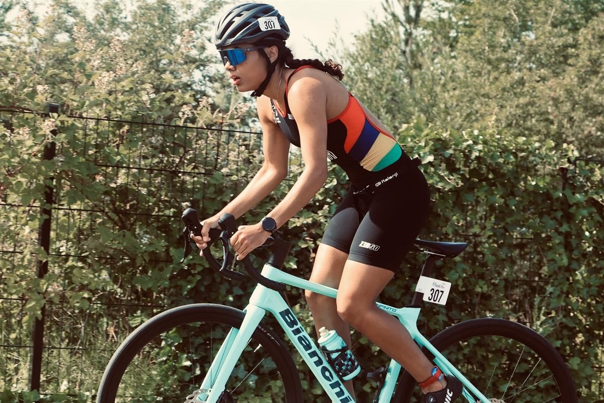 Triathlete racing on her road bike